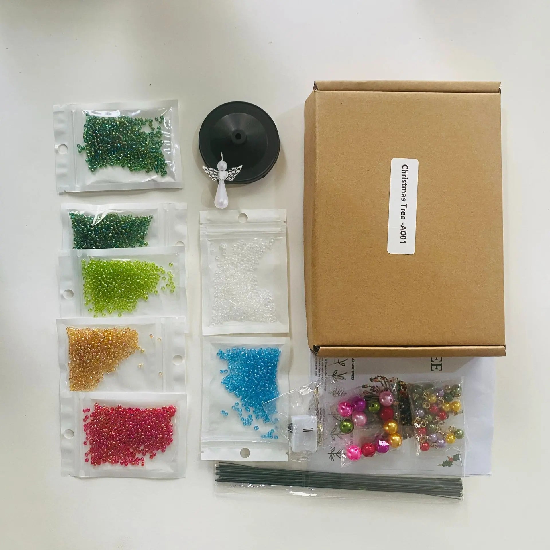 Beads, base, topper, rods, and accessories included in the craft kit