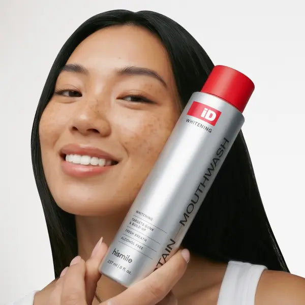 Hismile iD Stain Whitening Mouthwash held by model