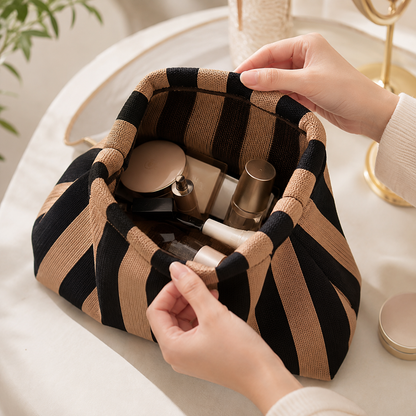 Wide-open makeup bag holding cosmetics and skincare
